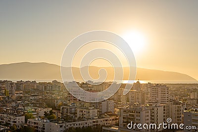 Attractive spring cityscape of Vlore city from Kuzum Baba. Captivating sunset sescape of Adriatic sea. Spectacular Stock Photo