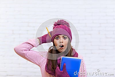 Attractive Stunned Teenage Girl In Pink Hat Student Shocked Holding Folder Pencil Stock Photo