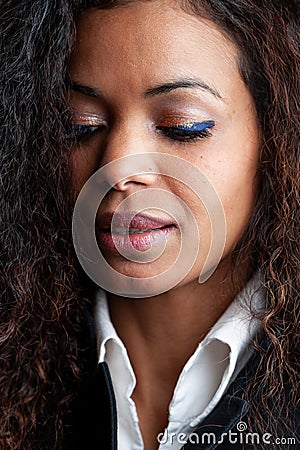 Attractive thoughtful woman wearing eye makeup Stock Photo