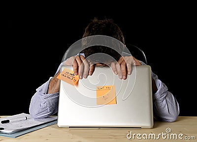 Attractive tired businessman tired overwhelmed heavy work load exhausted at office Stock Photo