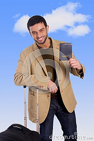 Attractive traveler man leaning on luggage case holding passport smiling happy and confident Stock Photo