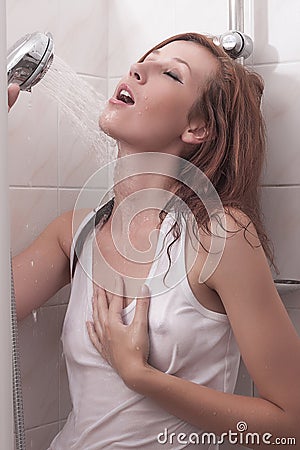 Attractive wet brunette girl in shower Stock Photo
