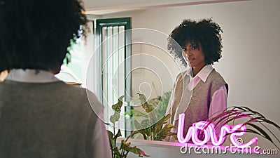 Dancing woman admiring reflection in mirror close up. Girl moving body at home. Stock Photo