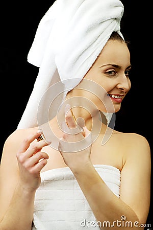 Attractive woman applying parfume. Stock Photo