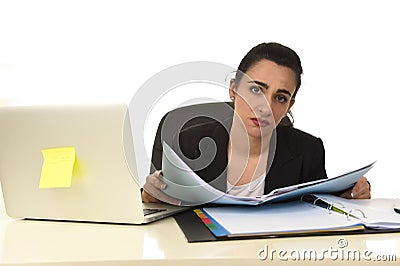 Attractive woman in business suit working tired and bored in office computer desk looking sad Stock Photo