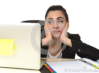 Attractive woman in business suit working tired and bored in office computer desk looking sad Stock Photo