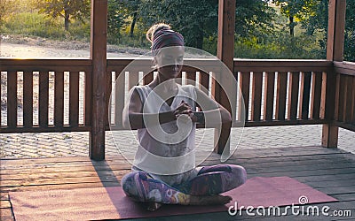 Attractive woman doing yoga exercises Stock Photo