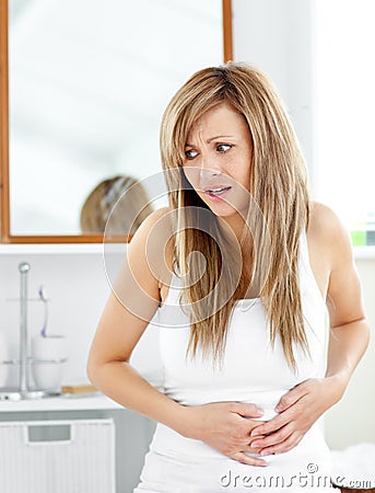 Attractive woman having a stomachache Stock Photo