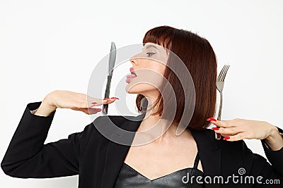 attractive woman knife and fork in hands emotions posing Lifestyle unaltered Stock Photo