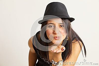 Attractive woman blowing a kiss at the camera Stock Photo