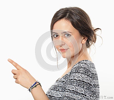 Attractive woman pointing her forefinger to the right Stock Photo