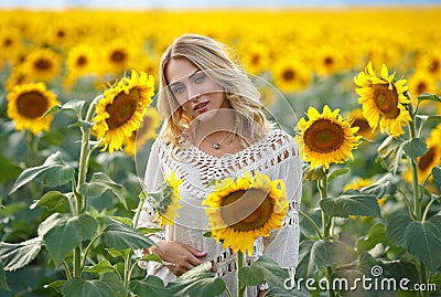 Attractive woman portrait in a sunflowers Stock Photo