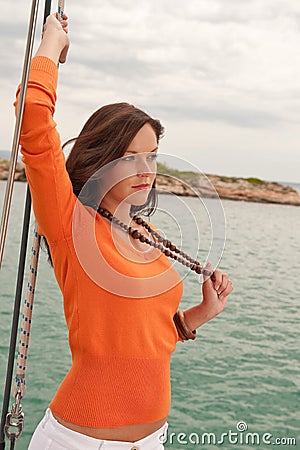 Attractive woman sailing on luxury yacht Stock Photo