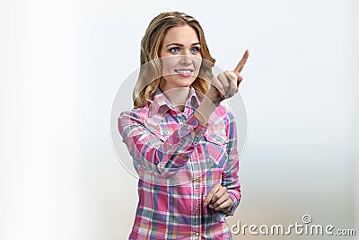 Attractive woman using invisible interface. Girl working on virtual screen. Stock Photo