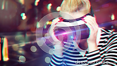 Attractive woman wearing virtual reality glasses. VR headset. Unusual double exposure virtual reality Stock Photo