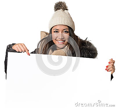 Attractive woman in winter fashion holding a sign Stock Photo