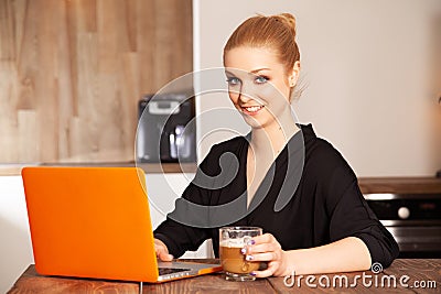 Attractive blonde student girl working on personal computer Stock Photo