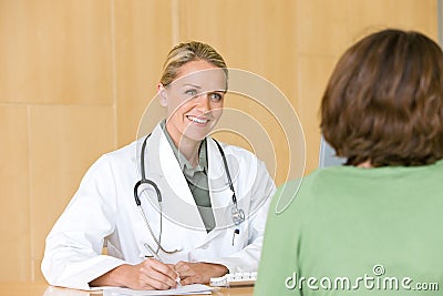 Attractive young caring doctor Stock Photo