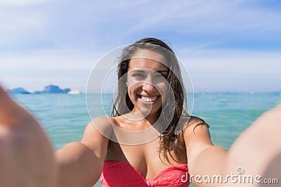 Attractive Young Caucasian Woman In Swimsuit On Beach Taking Selfie Photo, Girl Blue Sea Water Holiday Stock Photo
