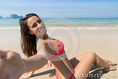 Attractive Young Caucasian Woman In Swimsuit Sitting On Beach, Girl Taking Selfie Photo Blue Sea Water Holiday Stock Photo