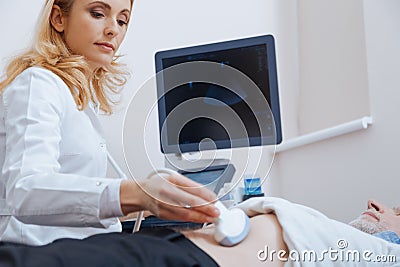 Attractive young doctor enjoying responsibilities in the hospital Stock Photo