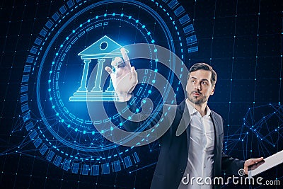 Attractive young european businessman using creative round polygonal banking hologram on blurry background. Digital transformation Stock Photo