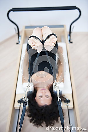 Attractive young lady doing pilates Stock Photo