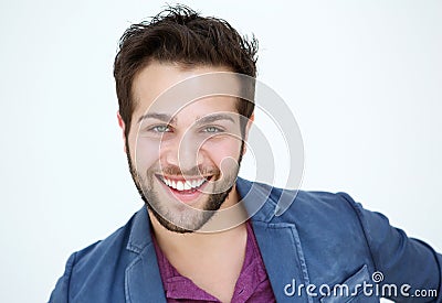 Attractive young man with beard smiling on white background Stock Photo