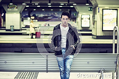 Attractive young man inside station Stock Photo