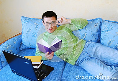 Attractive young man reading a book. Stock Photo