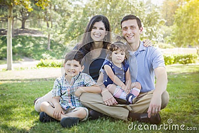 Attractive Young Mixed Race Family Outdoor Park Portrait Stock Photo