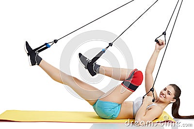 Attractive young woman doing exercises with expander on isolated Stock Photo