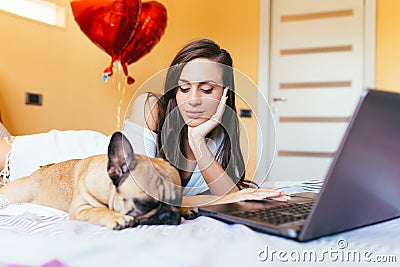 Attractive young woman with her dog Stock Photo