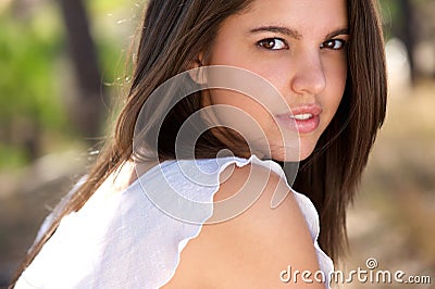 Attractive young woman posing outside in forest Stock Photo
