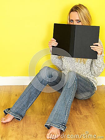 Attractive Young Woman Reading a Book Stock Photo