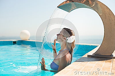 Attractive young woman refresh in pool Stock Photo