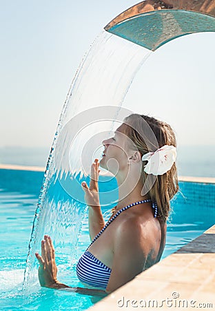 Attractive young woman refresh in pool Stock Photo
