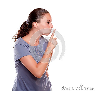 Attractive young woman requesting silence Stock Photo