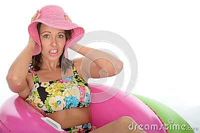 Attractive Young Woman Sitting in Rubber Ring Wearing a Swimsuit Stock Photo