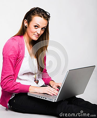 Attractive young woman smiling with laptop Stock Photo