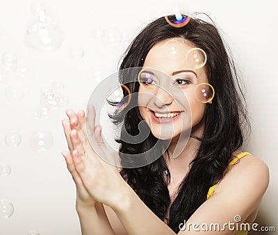 Attractive young woman with soap bubbles Stock Photo