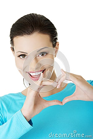 Attractiveyoung woman showing heart gesture Stock Photo