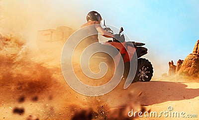 Atv riding in sand quarry, dust clouds, quad bike Stock Photo