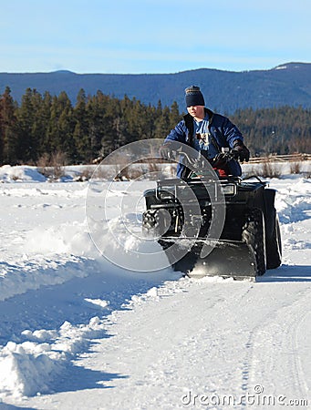 Atv snow plow Stock Photo