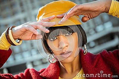 Atypical African American model lifting her hands up to head Stock Photo