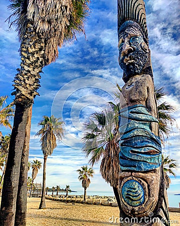 atypical beach in Port-Grimaud with tikis Stock Photo