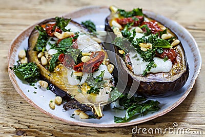 Aubergine with goat cheese and crispy kale Stock Photo