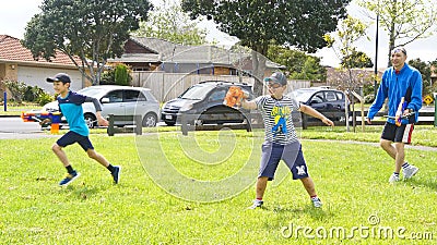 Auckland, New Zealand, 10th of Nov 2019, adults and kids playing nerf gun together at an outdoor children playground Editorial Stock Photo