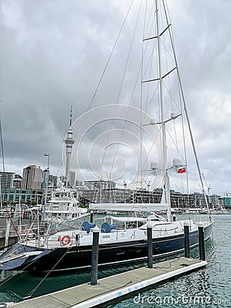 Auckland skyline. View from Viaduct Basin with a sailboat on foreground Editorial Stock Photo