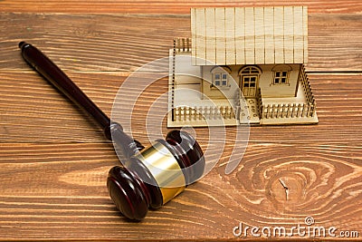 Auction. Law. Miniature House on wooden table and Court Gavel Stock Photo